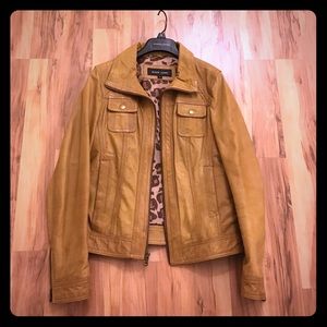 Women's black rivet leather jacket.